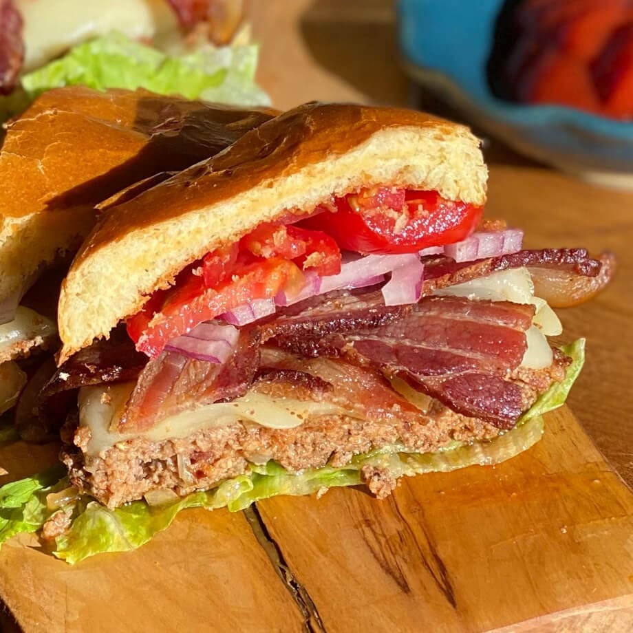 How to Cook Bacon: 5 Different Ways to Make Bacon 1 pork burger with bacon cut in half